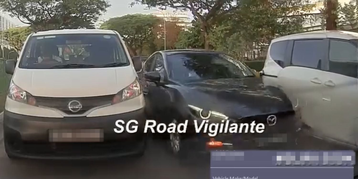 car squeezing between 2 other vehicles