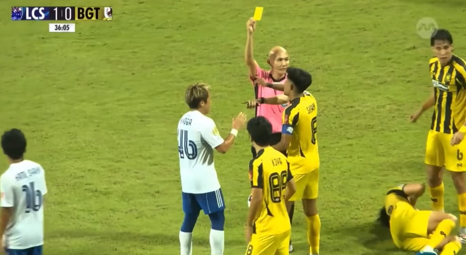 referee giving yellow card