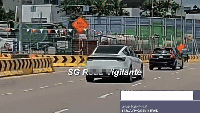 tesla travelling in middle lane