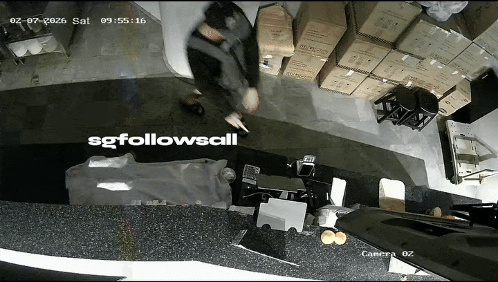 man prying open cupboard