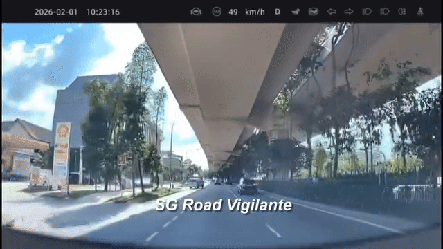 car approaches traffic light