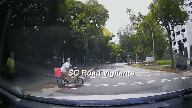 driver barely avoids hitting cyclist