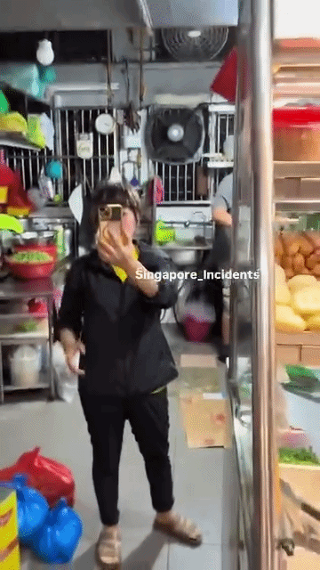man records female stall worker