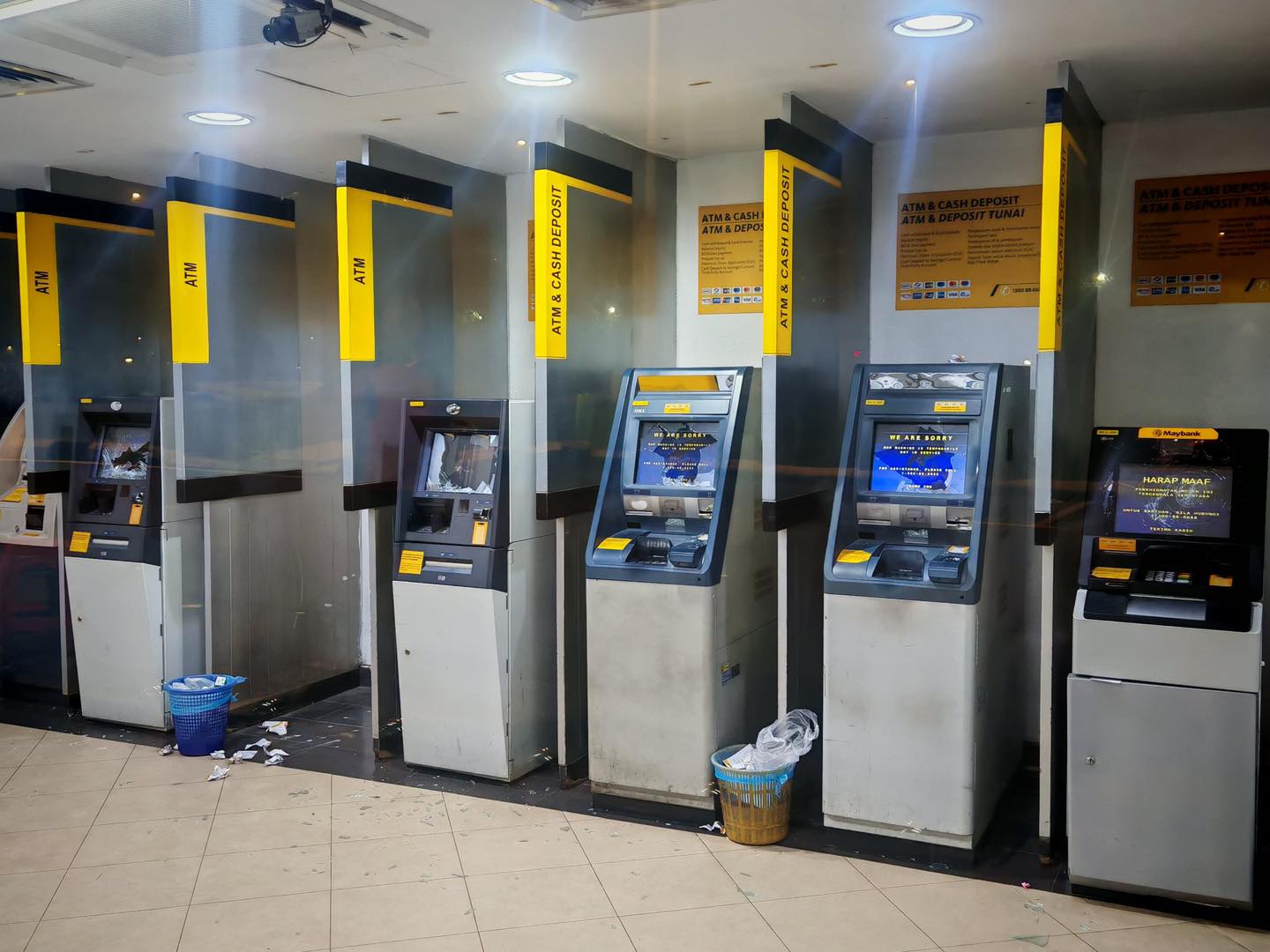 man breaks atm bank screens