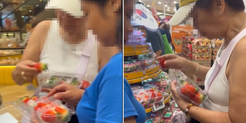woman swaps strawberries with bare hands in FairPrice outlet at Bedok Mall