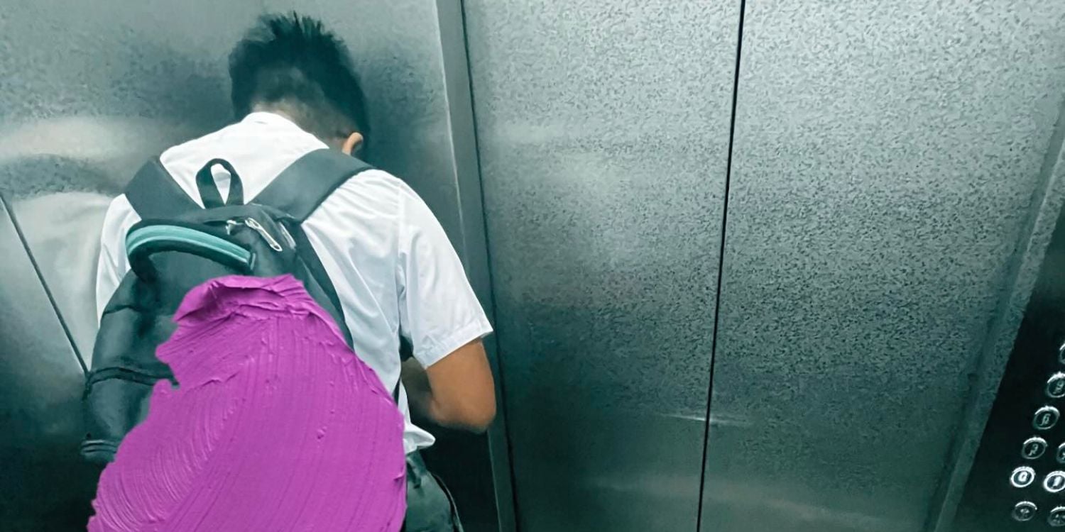 boy turns away eat elevator