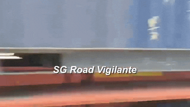 man squat under tree