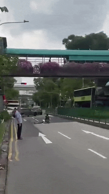woman still lying on road