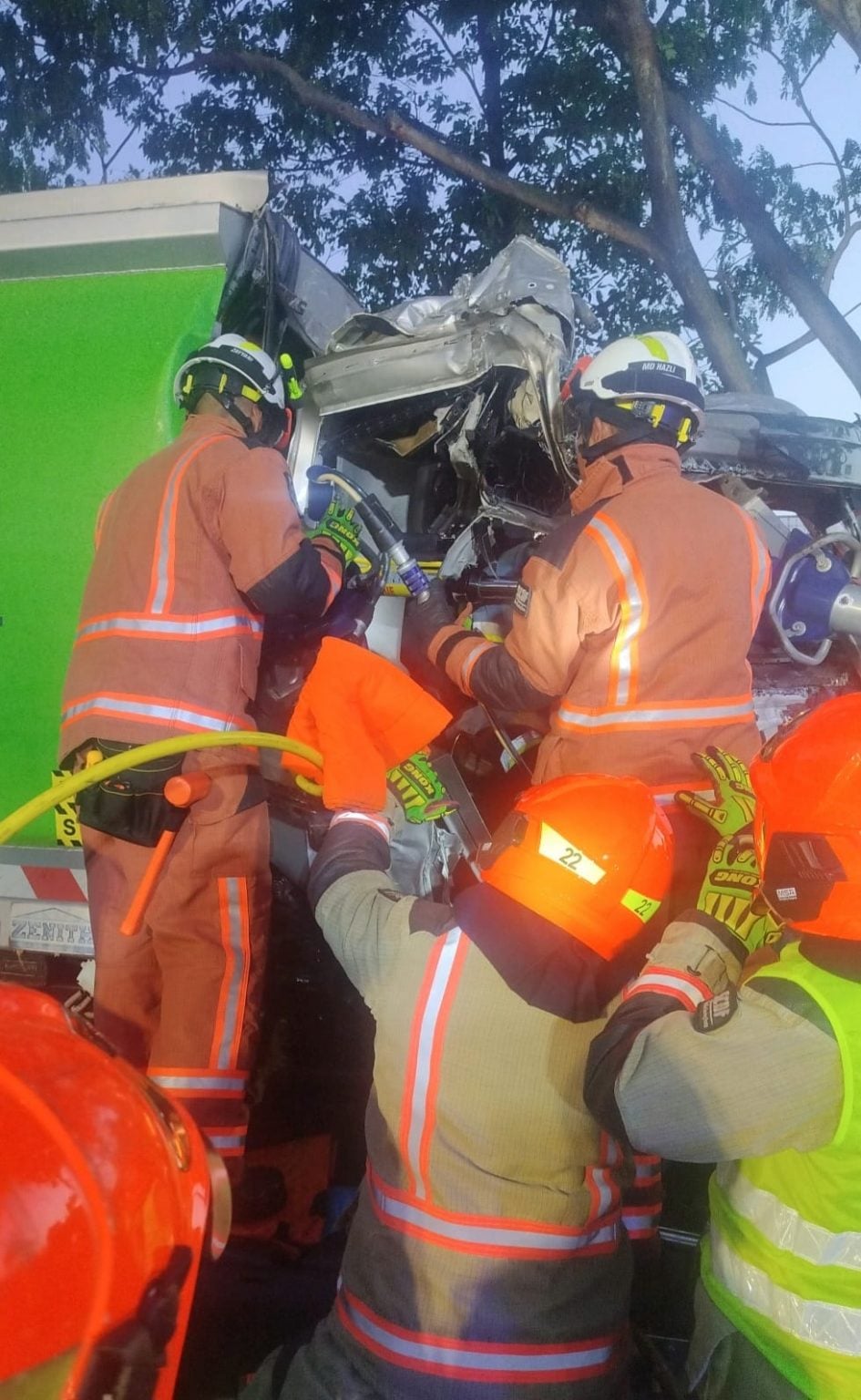 Driver trapped after garbage truck collides with tree in Hougang, gets ...
