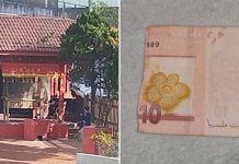 temple caretaker rips banknote