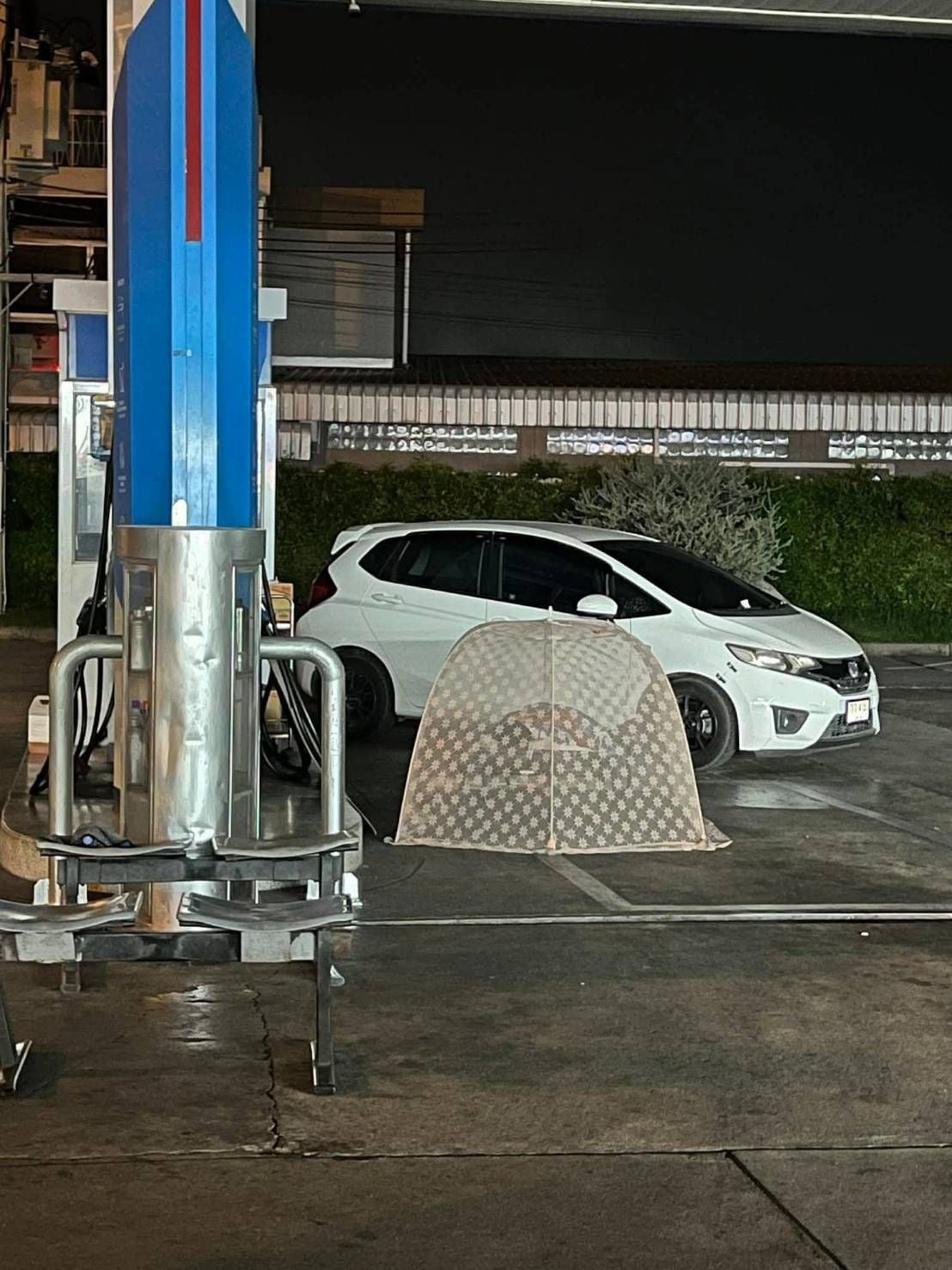 tent gas station queue camp