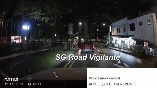man turns around to look at oncoming car