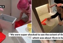 Kim Lim and Xiaxue helping to scoop water in flooded spa