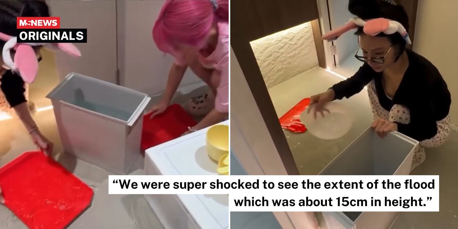Kim Lim and Xiaxue helping to scoop water in flooded spa