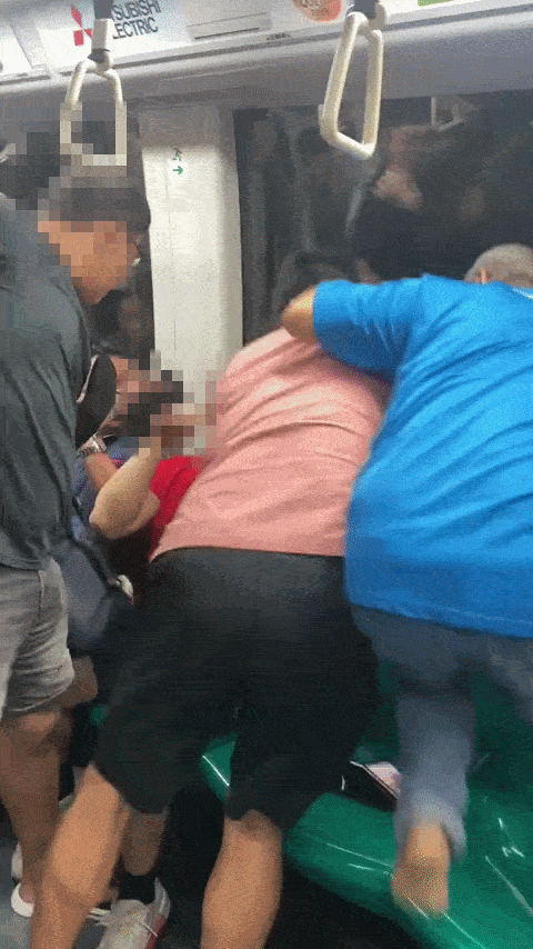 man tries to punch younger man in red t-shirt