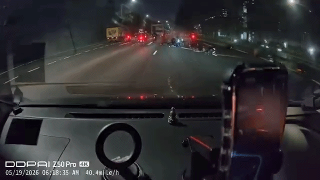 motorcycle strewn across road