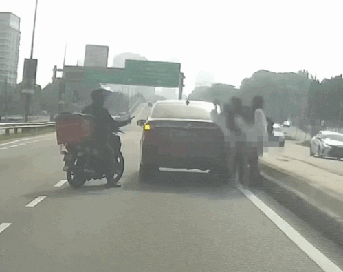 woman jumps moving phv malaysia (1)