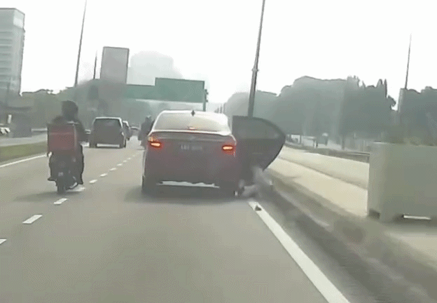 woman jumps moving phv malaysia (3)