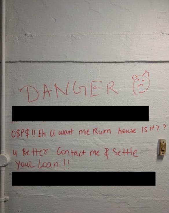 loanshark-related graffiti corridor