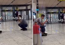 man squats airport