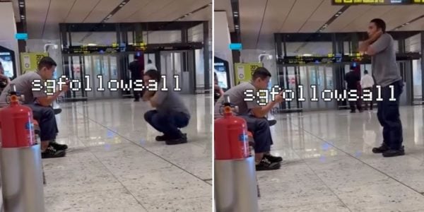 man squats airport