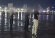 tourists urinate beach